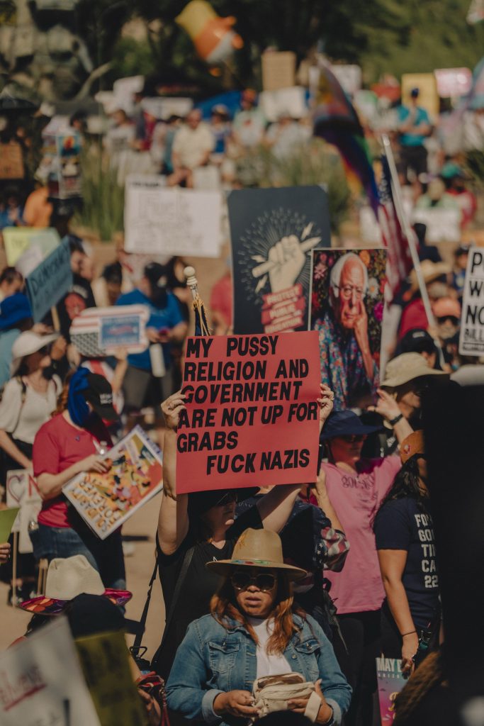 Wide angle image of protest gathering at Arizona State Capitol.
