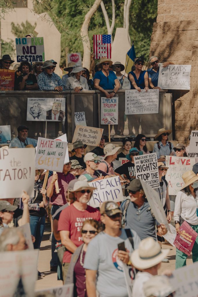 Wide angle image of protest gathering at Arizona State Capitol.